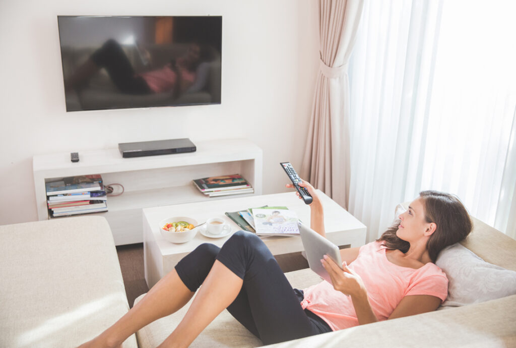 Woman Streaming TV with Tablet