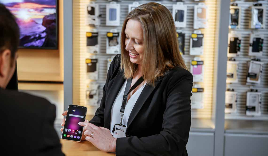 Cellular Sales wireless expert showing features of Android smartphone