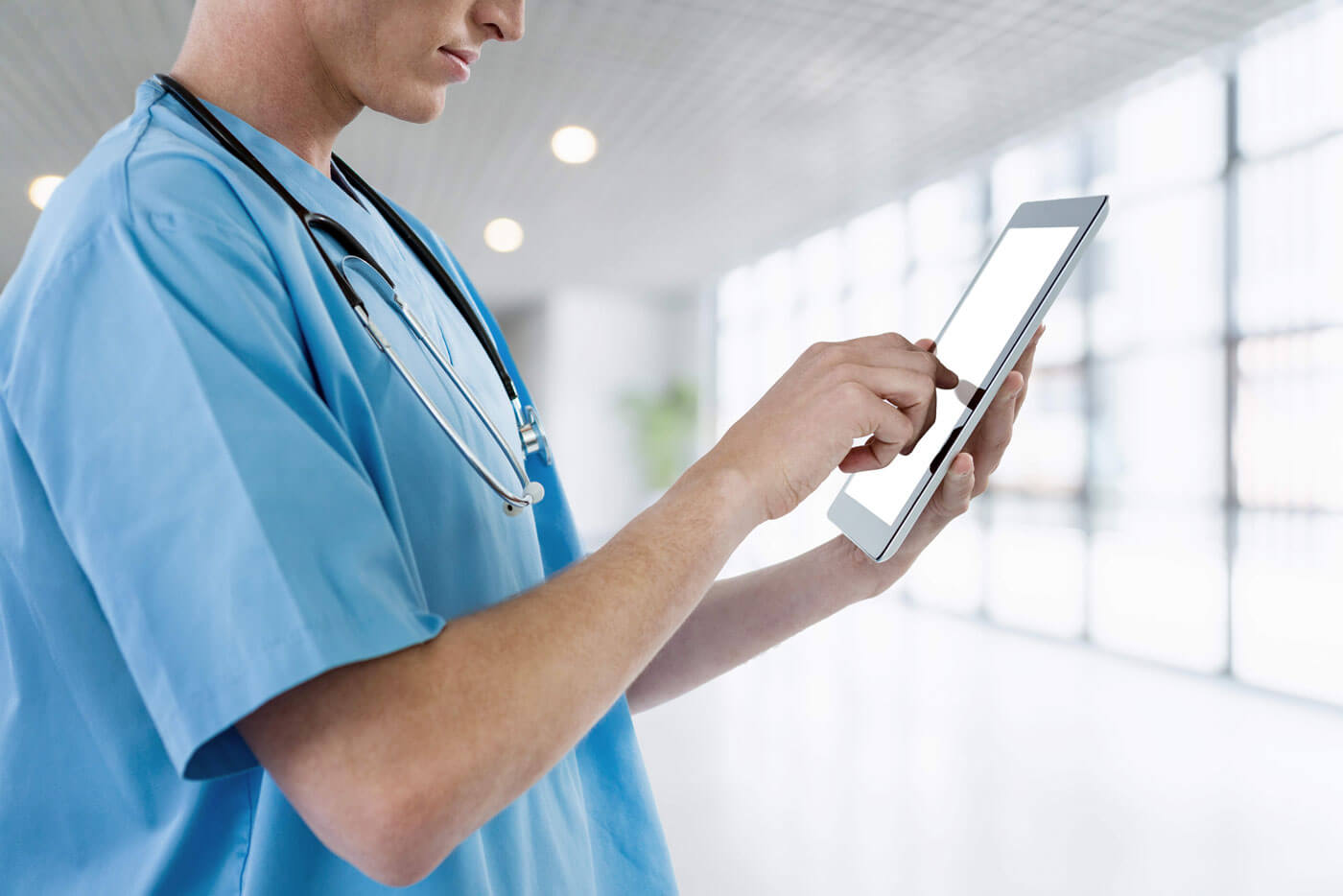 nurse holding tablet - verizon discount for nurses