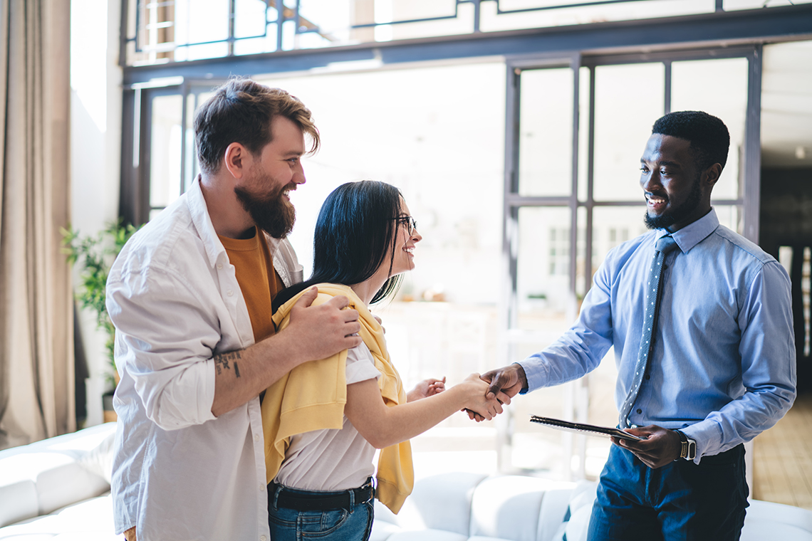 Realtor welcomes potential buyers into home