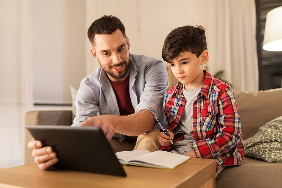 Father and son using best tablets for school