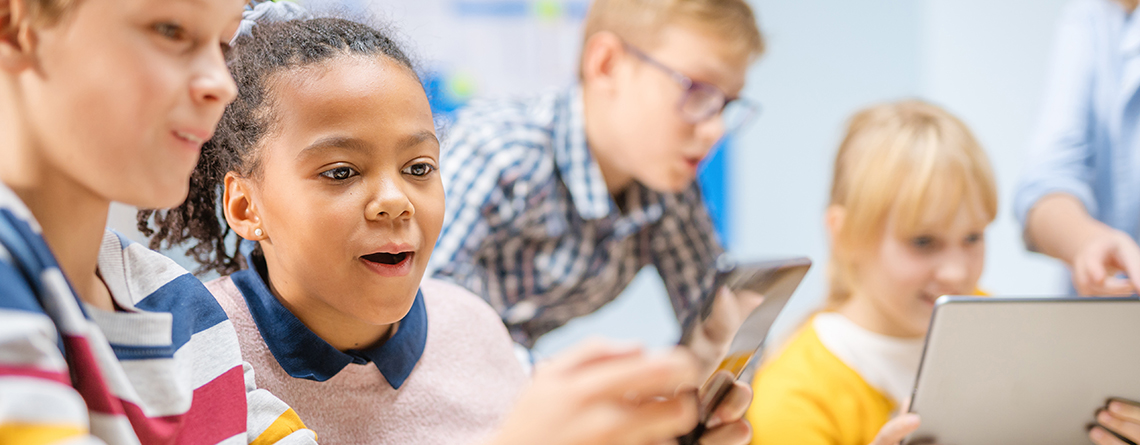 Children using tablet at school