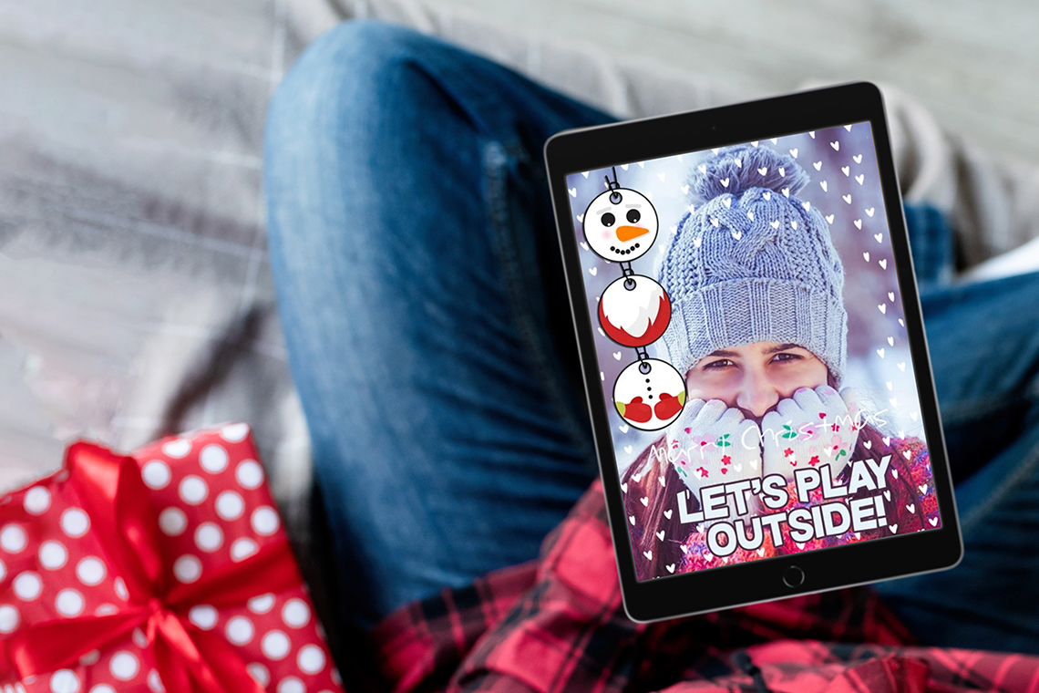 person using holiday card maker app from Google Play Store