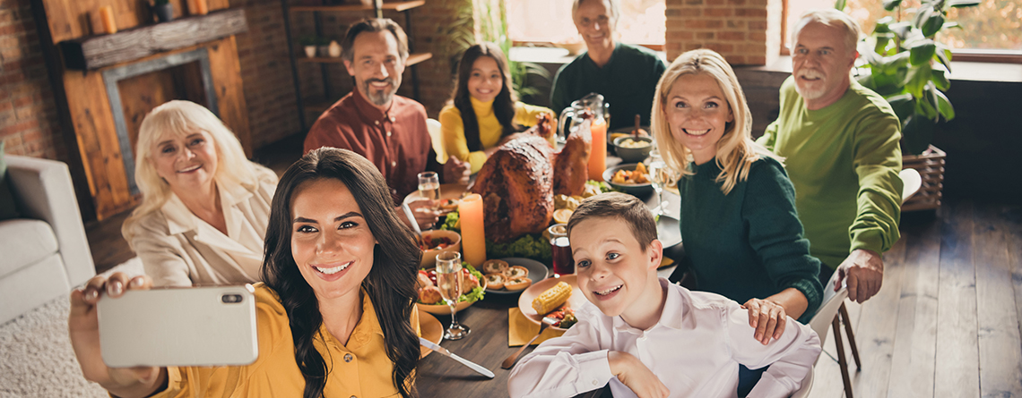 family taking selfie at thanksgiving dinner