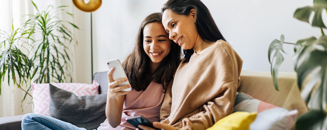 mother and daughter using 5G home internet to facetime family on tablet