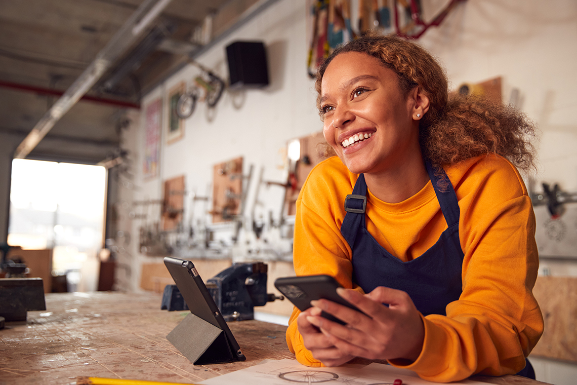 business owner with apple iphone with 5G ultra network