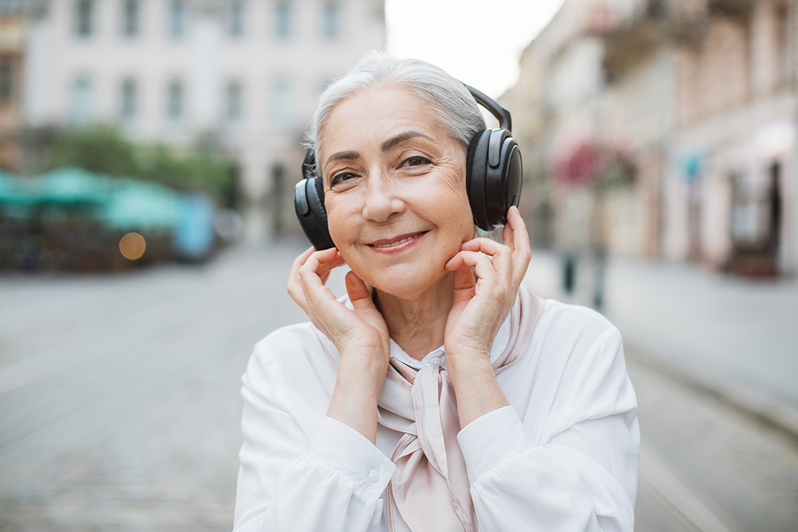 senior woman with JBL BT500 headphones