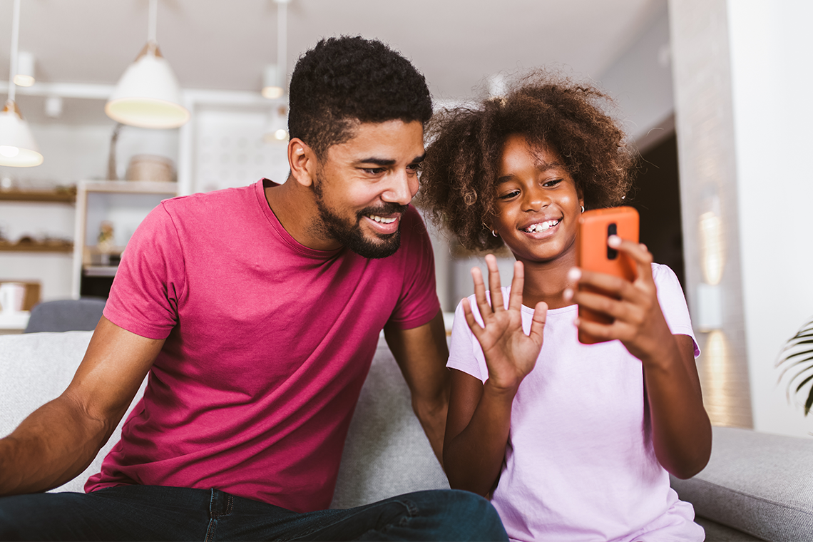 father and daughter using 5G home internet to facetime family