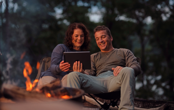 couple camping fire
