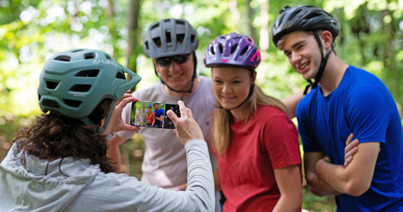 family taking picture on bike ride