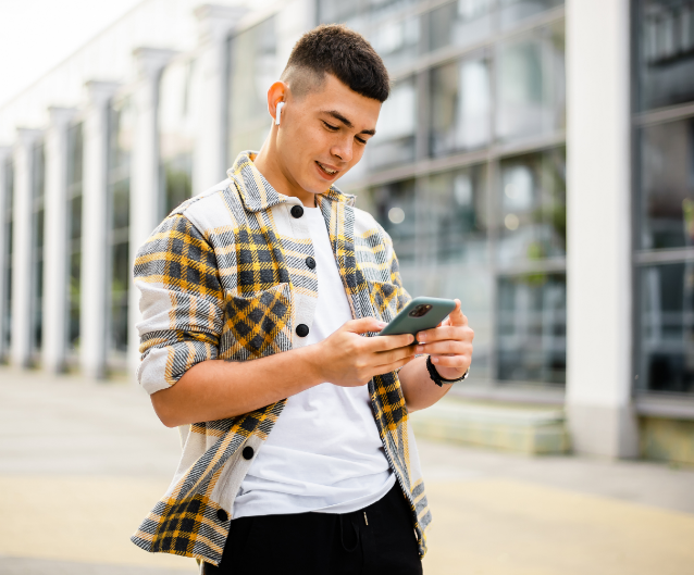 man walking listening to music on phone