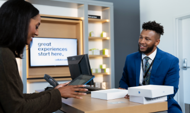 employee showing tablet to customer
