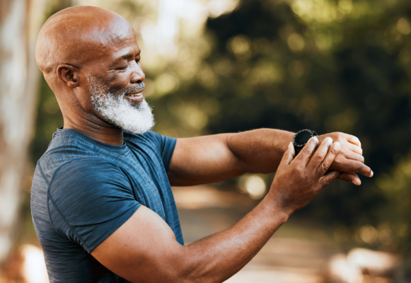 man looking at smartwatch