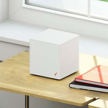verizon router on desk next to books