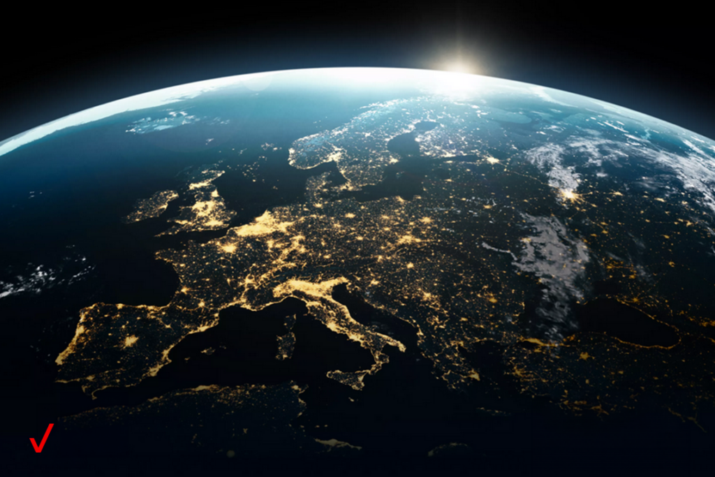 A view of the earth from space with cities shown lit up across a dark continent.